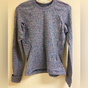 Lululemon size 6 long sleeve tunic with finger hole and key pocket.